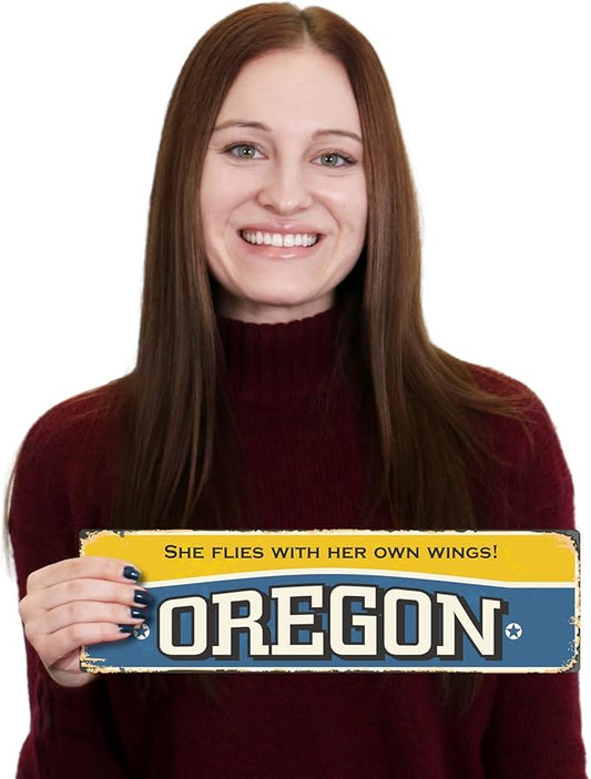 SmartSign 4 x 14 inch Oregon State Vintage Metal Sign “She Flies With Her Own Wings”, 40 mil Rustproof Aluminum with Clear Overcoat, Retro Wall Décor, Multicolor, Made in USA