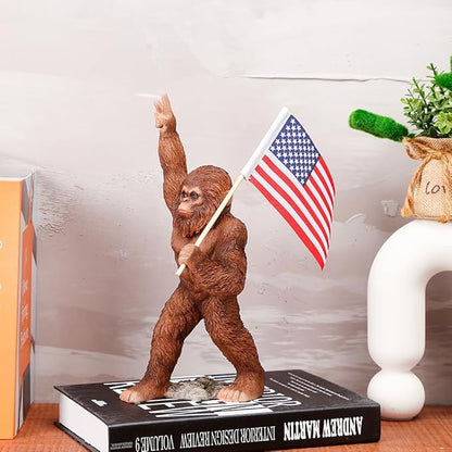 The Bigfoot Statue Holding The National Flag, A 10.4-Inch Resin Statue, Sasquatch Gifts. Bigfoot Decor is Suitable for Outdoor and Indoor Decor. Father's Day
