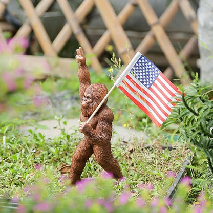 The Bigfoot Statue Holding The National Flag, A 10.4-Inch Resin Statue, Sasquatch Gifts. Bigfoot Decor is Suitable for Outdoor and Indoor Decor. Father's Day