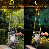Thyle Solar Light Outdoor Raccoon Statues 19" H Hanging Raccoon on Swing with LED Light Resin Waterproof Hanging Animal Figurine with Hook for Yard Garden Wall Decoration Gift