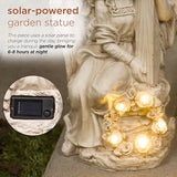 Alpine Corporation KGD574SLR Solar Angel Holding Cross Statue with LED Lights, Sentimental Decor for Garden, 14" H, White